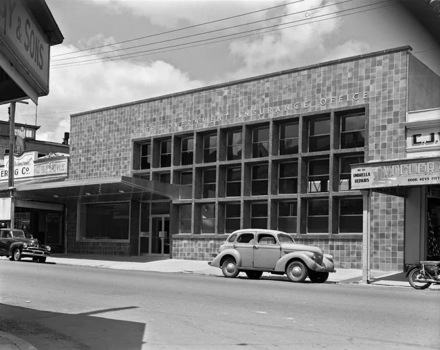 State Government Insurance Office, Ipswich, 1958. The Queensland Government established the State Government Insurance Office in 1917. SGIO was responsible for insuring state assets and offering life insurance and general insurance to the Queensland public. Secretary of state search: exact, starts-with and contains